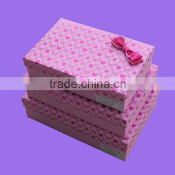 Romantic rectangular pink paper gift box with bow