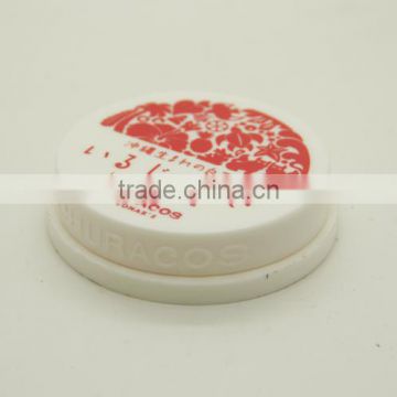 Empty lipstick container and round plastic container