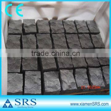 Black rough cobble stone paving