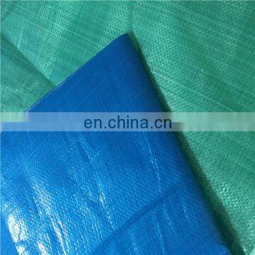 Tarpaulin with plastic eyelets