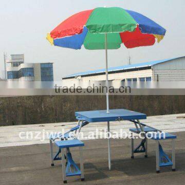 Plastic picnic table with umbrella