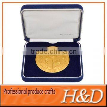 gold medal badge with ribbon & blue box