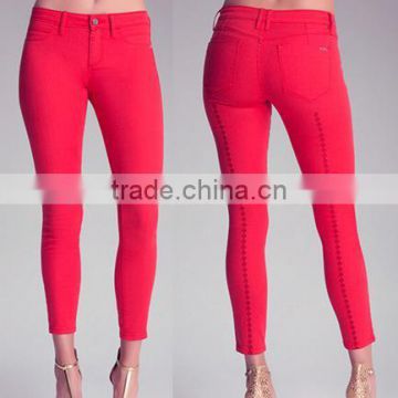 red color amazing lady mid waist jeans feature diamond accents up the back leg and a luxe fit