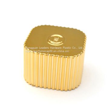 Gold plastic perfume cap with added weight