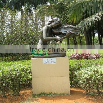 Metal lady playing violin statue