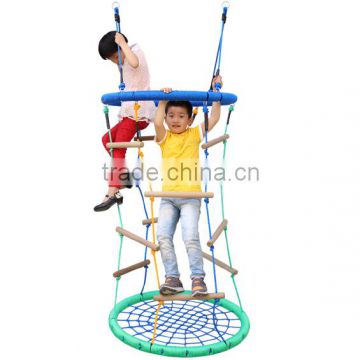 Nest swing with wooden rope ladders