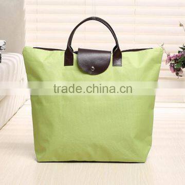 Light green folding shopping bag for packing with canvas material