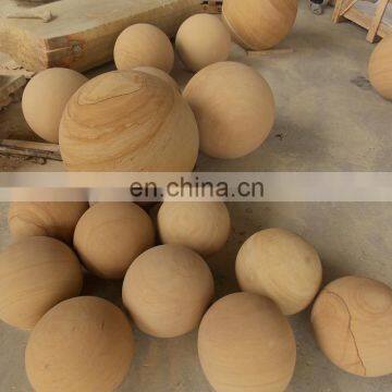 Yellow sandstone round ball for garden