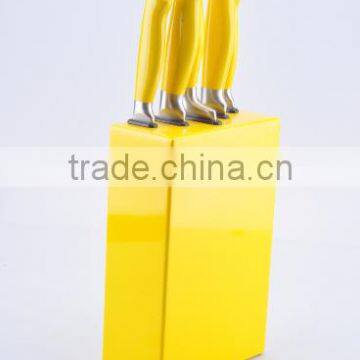 Yellow handle kitchen knife set with a wooden stand