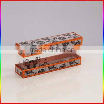 clear plastic box with rigid paper top and base