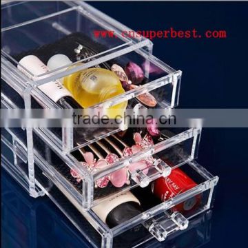 Clear acrylic makeup organizer with three drawers