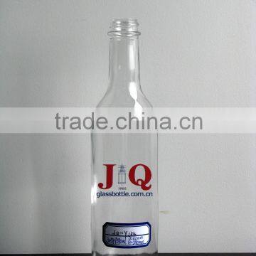 clear glass tomato sauce bottle