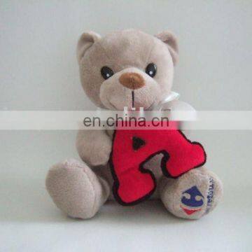 stuffed beddybear toy holding a letter, educational animal toy