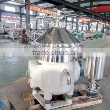 Continuous working liquid disc centrifuge milk separator