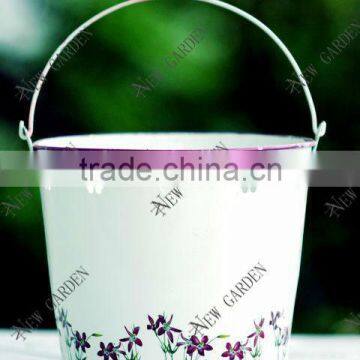 white garden watering metal bucket