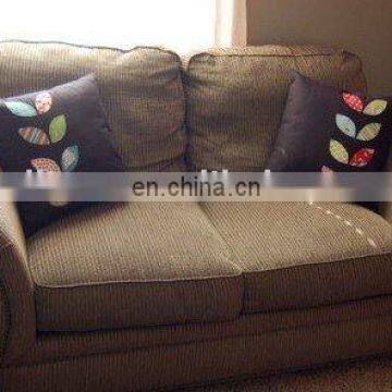 cushion cover with appliqued leaves