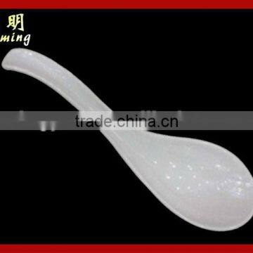 White plastic serving spoon