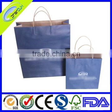 small colored manila gift paper bag with handles