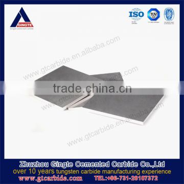 Tungsten carbide plates for EI