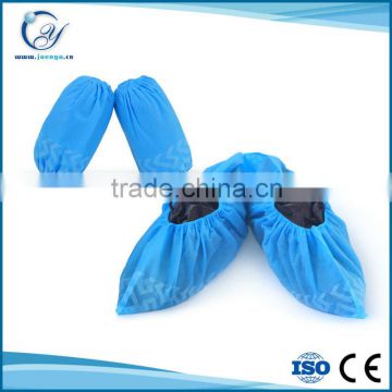 Non-skid disposable nonwoven shoe cover