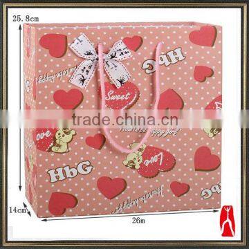 Cheap printed paper bags for garment packing with handles/ nice-looking gift paper bags