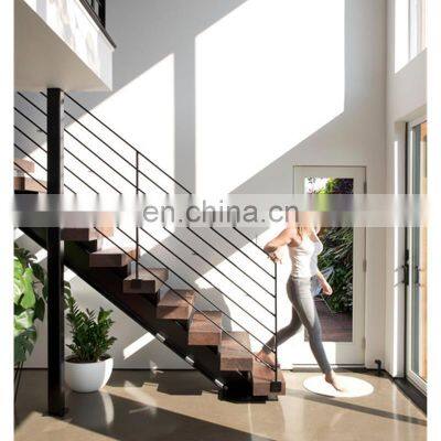 Interior staircase design wooden steps steel metal railing