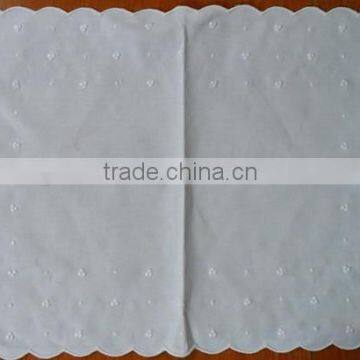 White on white embroidery placemat