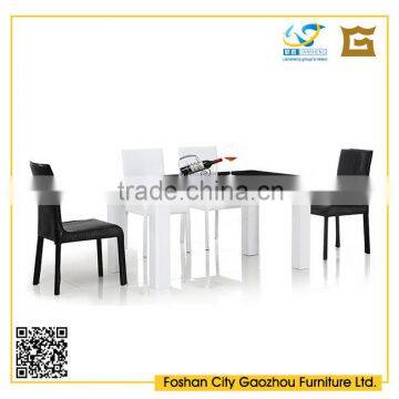 Latest fashion design black tempered glass top dining table sets with leather upholstered dining chair