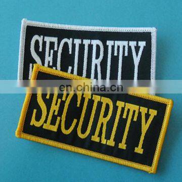 overlocked different shape and color brand adhesive woven badges manufactory