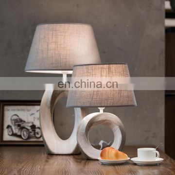 China wholesale cheap hotel bedside lamp custom vintage white office table lamp ceramic with logo