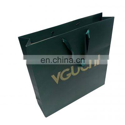 China Supplier Wholesale High End Customized Printing Logo Packaging bag for clothes Ribbon Carry handle paper bag