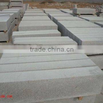 sawncut and beveled grey granite kerbstone