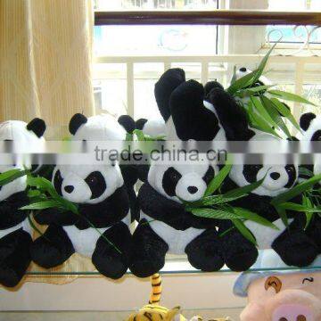 plush panda with bamboo