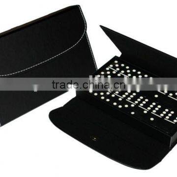 Black domino set in leather pouch