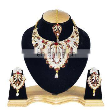 Touch Stone Gold Plated Dark Red Color Alloy Wedding Collection Necklace Earrings Set & Tikka