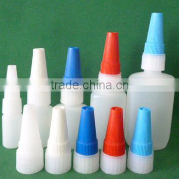 empty flat plastic super glue bottle with metal pin cap