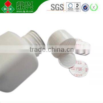 Adhesive bottle cap fiber desiccant