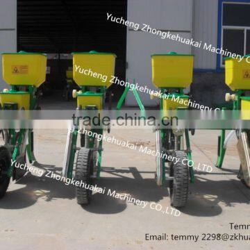 Four row corn planter by tractor