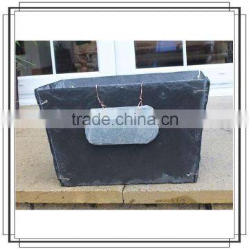 Black open slate stone leafiness plants pots