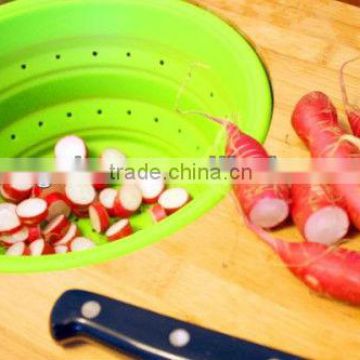 wooden cutting board with collapsible colander