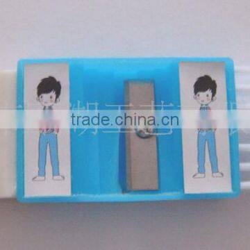 Plastic sharpener with eraser and brush