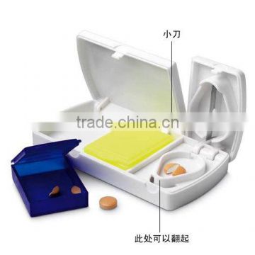 Promotional plastic pill cutter box with blade