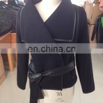 woman's black wool coat with sheep leather hem and belt