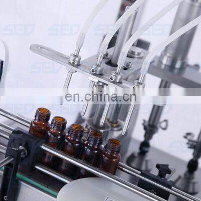 Nice Quality Automatic 4 Heads Glass Bottle Filling and Capping Machine photo-3