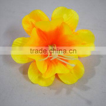 fake daffodil flower heads for the cemetery arrangement