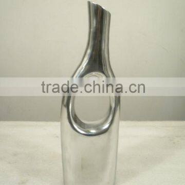 polished aluminium vase