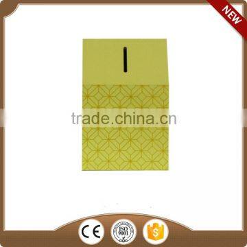 Yellow wooden piggy bank