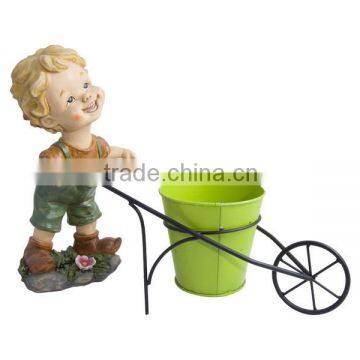 cute little boy doll pushing car resin statues