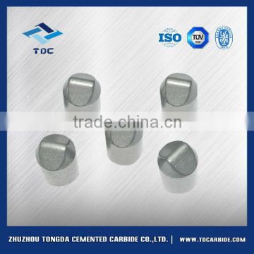 Tungsten carbide buttons for roller cone bits