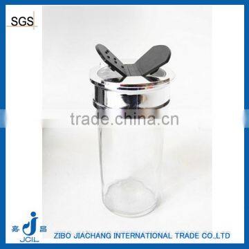 small clear glass paragon spice jars with butterfly cap